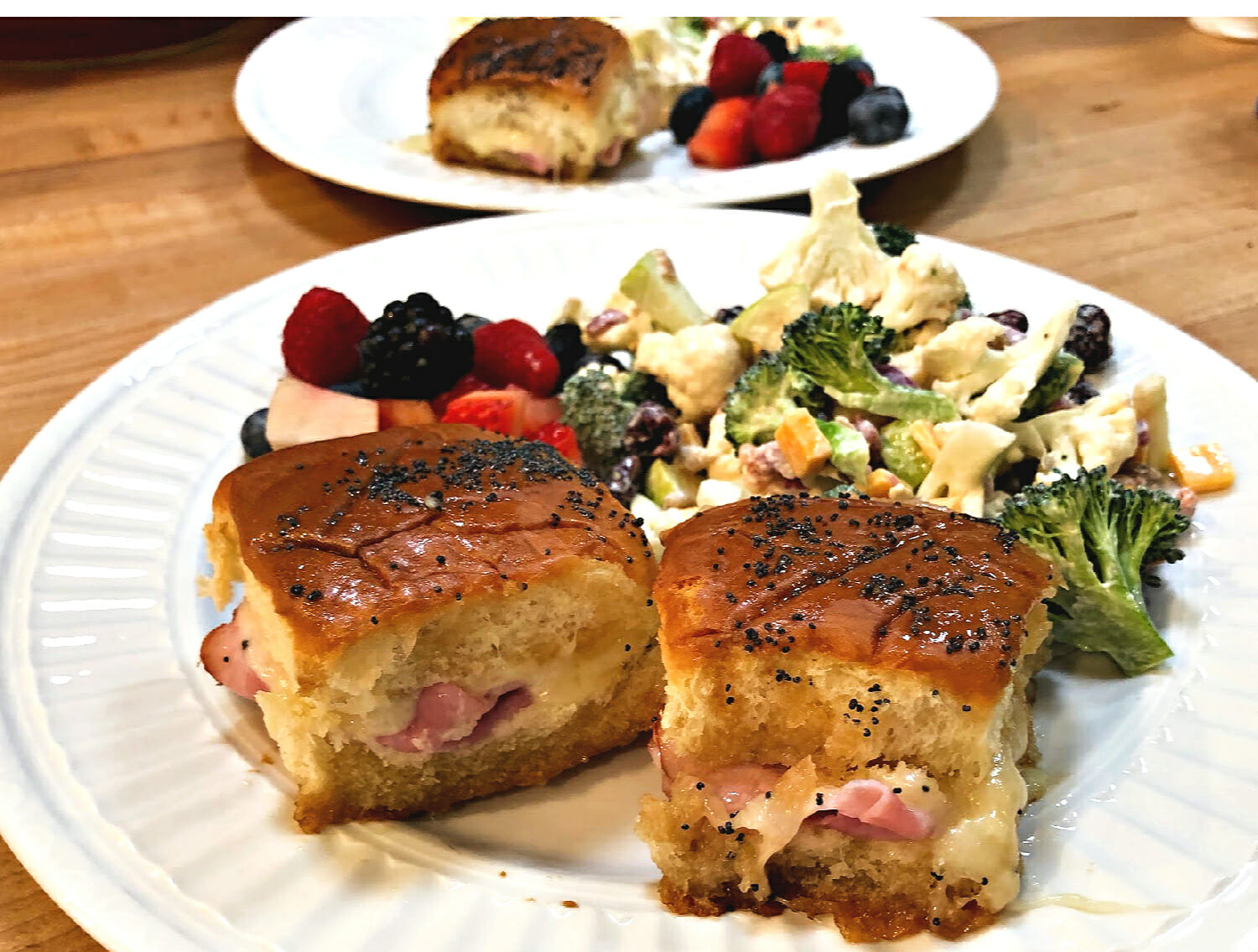 baked sandwiches with salad and fruit