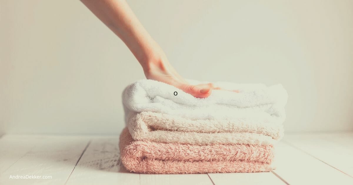 How To Clean Stinky Towels And Prevent Future Smells Andrea Dekker - Why Does My Bathroom Smell Like Wet Towels