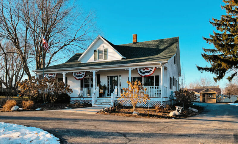 farmhouse with melting snow